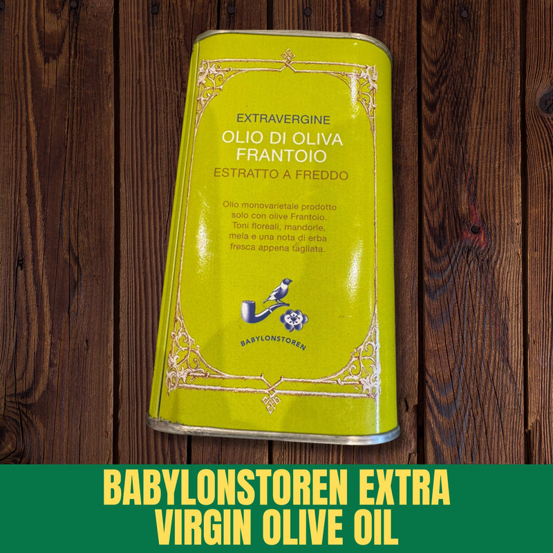 Green olive oil tin with Babylonstoren branding on a wooden background
