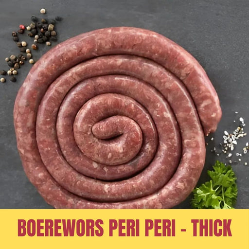 Coiled boerewors with spices and herbs on a dark surface, labeled 'Boerewors Peri Peri - Thick'.