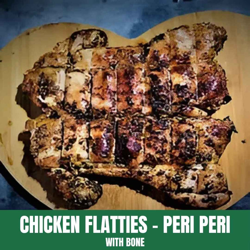 Peri peri chicken flatties with bone on a wooden board, labeled 'Chicken Flatties - Peri Peri with Bone'.