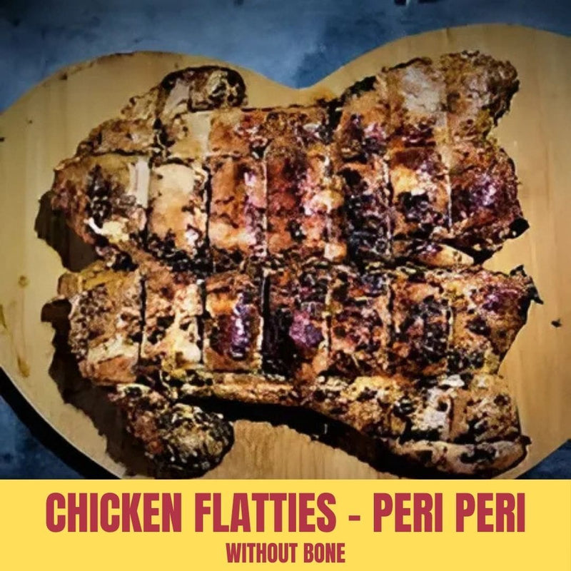 Grilled chicken flatties labeled 'Peri Peri' on a wooden board with a blue background.