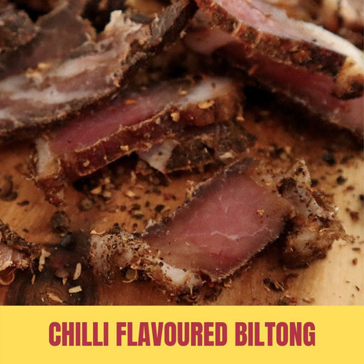 Close-up of sliced chili-flavored biltong with a yellow banner at the bottom.