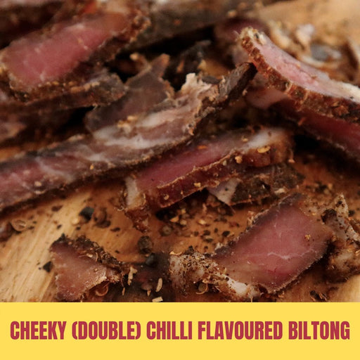 Sliced biltong with double chilli flavor on a wooden board