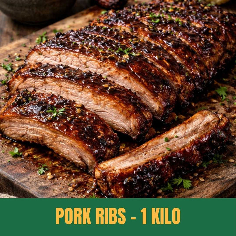 Sliced South African pork ribs on a wooden cutting board with text 'Pork Ribs - 1 Kilo'.