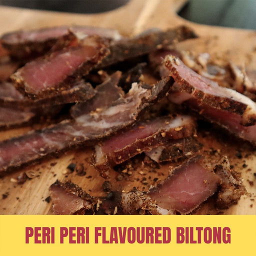 Peri peri flavoured biltong slices on a wooden board with text overlay.