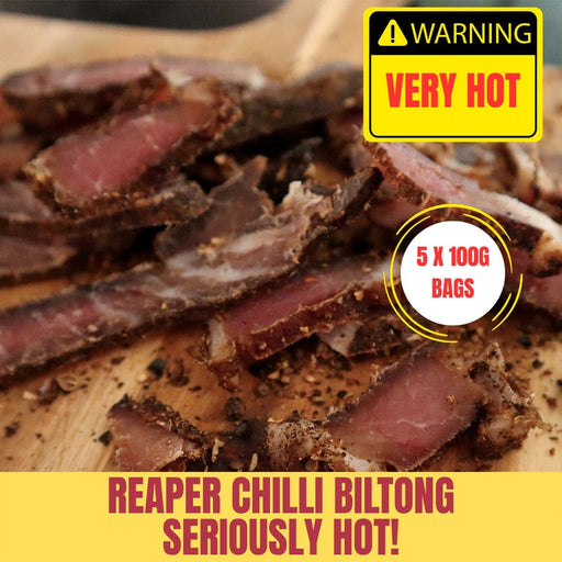 Reaper Chilli Biltong with a warning label on a wooden surface