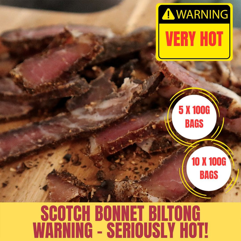 Scotch Bonnet Biltong slices on a wooden board with a 'Very Hot' warning label and product details.